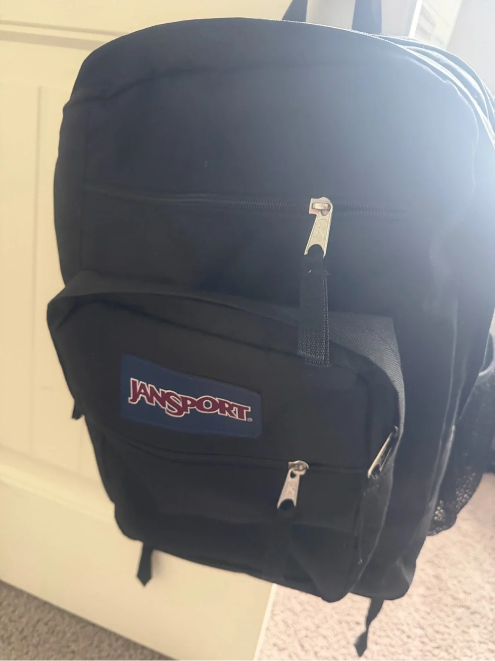 Jansport Black Backpack with Red Logo Patch